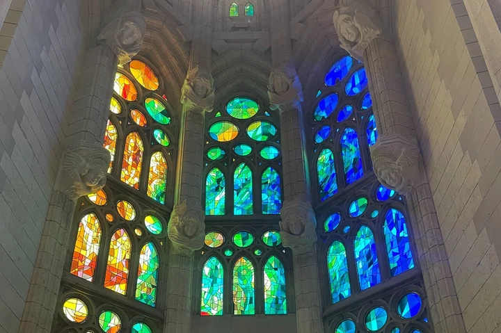 Blue, green and red stained-glass windows inside the Sagrada Familia